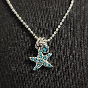 Touchstone Crystal Silver Starfish Necklace with Blue Crystals